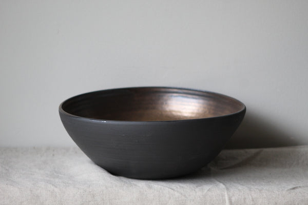 Bronze on black salad bowl