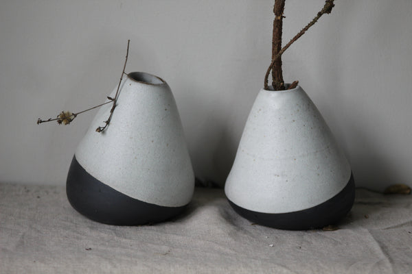 Tilted vase  set from black clay, waxy white glaze by GOLEM